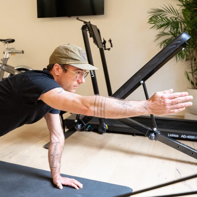 Client performing a bird dog exercise during a personal training session in Portland.